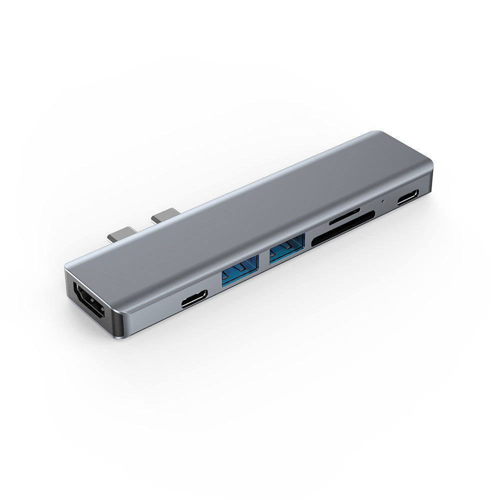 Silver aluminum laptop converter expansion dock with multiple ports including HDMI, PD100W, SD, TF, USB3.0, and USB2.0.